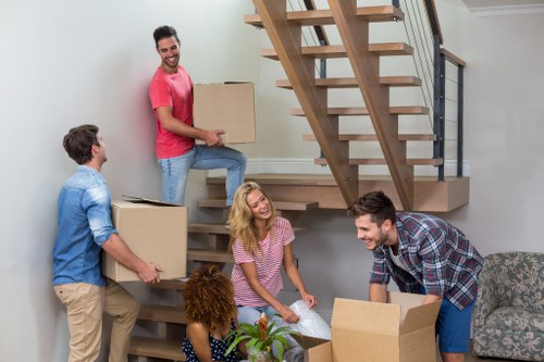 Man and Van service in West Hampstead with movers loading a van
