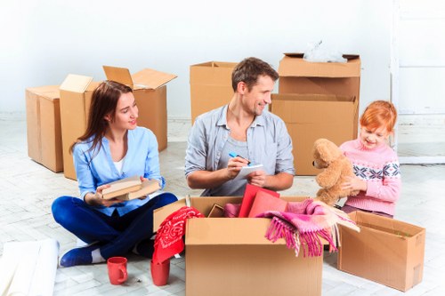 People moving items into a storage truck