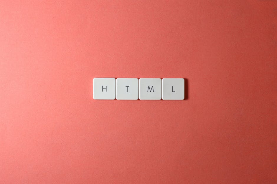 Four white square tiles with black lettering spelling 'HTML' are arranged in a straight horizontal line on a smooth, pinkish-peach background. The tiles are evenly spaced and centered in the image, wi